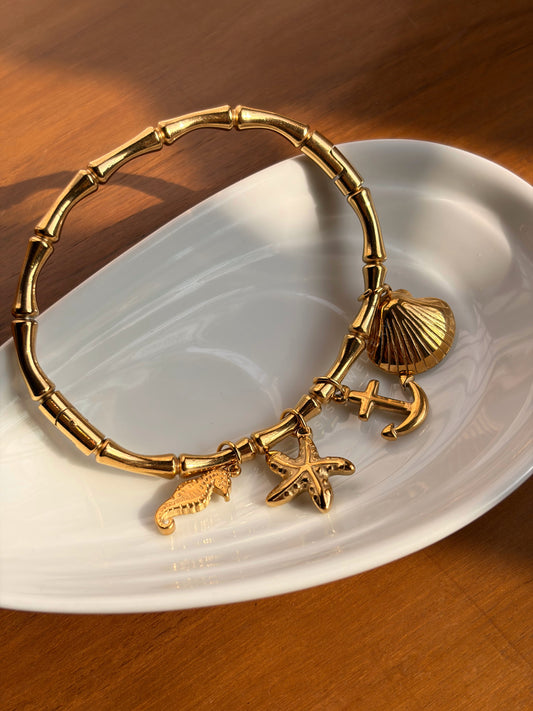 Marina Stainless Steel Charm Bangle Bracelet With Seahorse, Seashell, Anchor & Starfish Charms